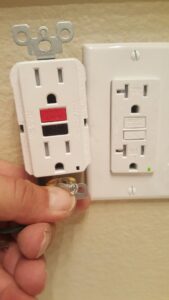 A new GFCI outlet being installed next to an existing one by an electrician from Canyon Electric Company, Inc. in North Las Vegas, NV