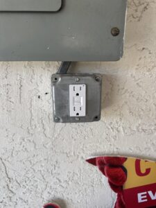 A newly installed GFCI outlet on an exterior wall by Dynamic Electric in Cape Coral, FL.