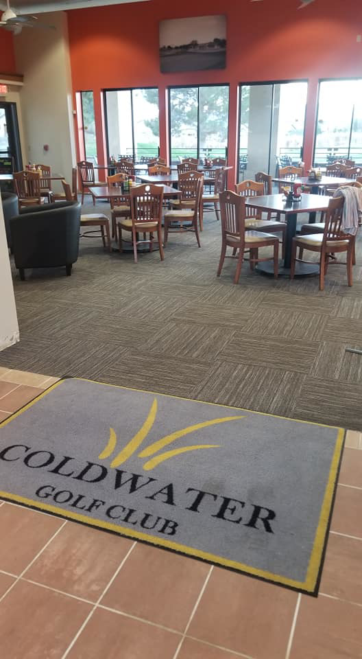 A golf club lounge area with new carpet tile flooring installed by Timeless Flooring in Peoria, AZ