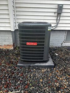 A Goodman outdoor air conditioning unit installed by Detroit Metro Mechanical, Inc. in Harrison Township, MI.