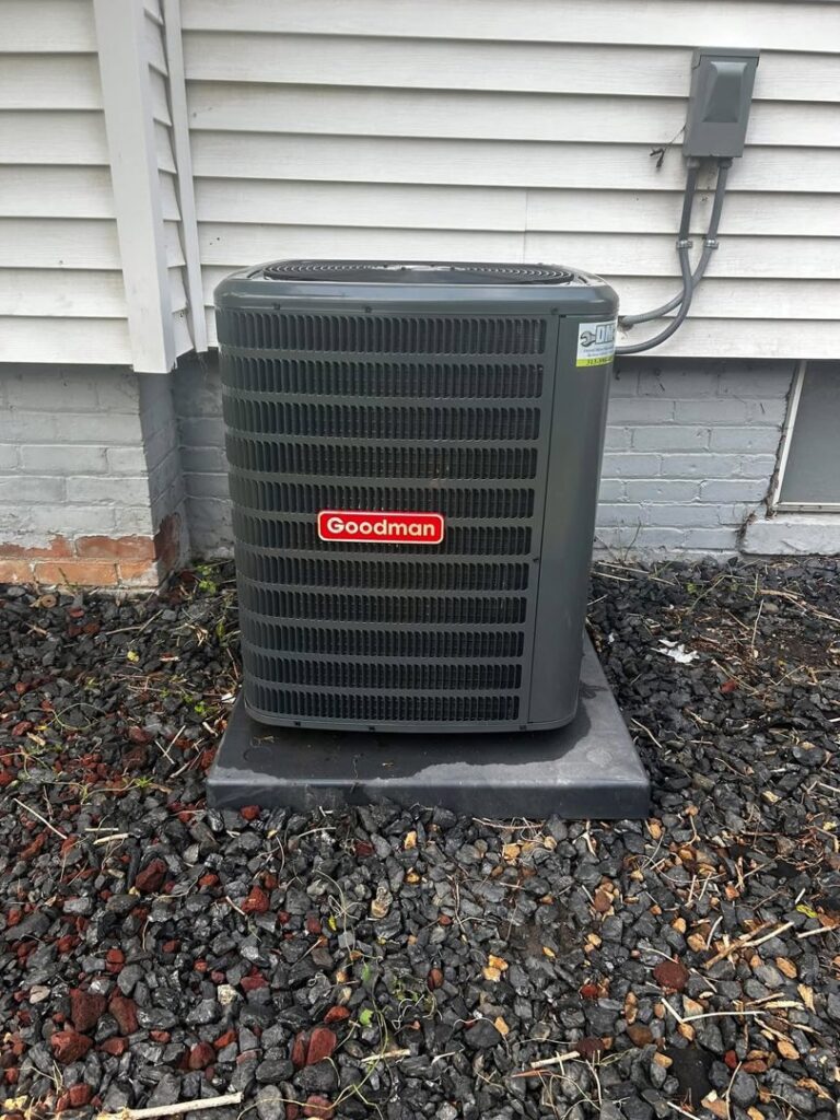 A Goodman outdoor air conditioning unit installed by Detroit Metro Mechanical, Inc. in Harrison Township, MI.