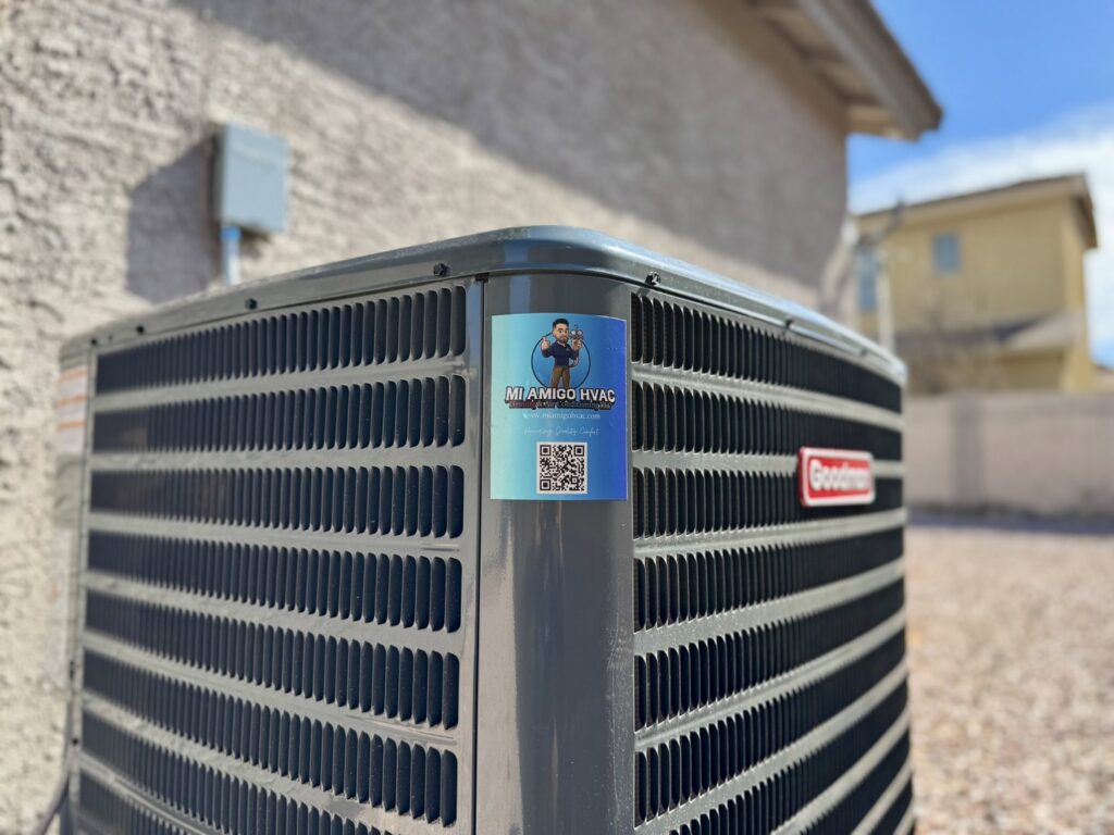 A Goodman outdoor AC unit with the business sticker installed by Mi Amigo HVAC in Surprise, AZ
