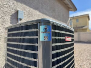 A Goodman outdoor AC unit with the business sticker installed by Mi Amigo HVAC in Surprise, AZ