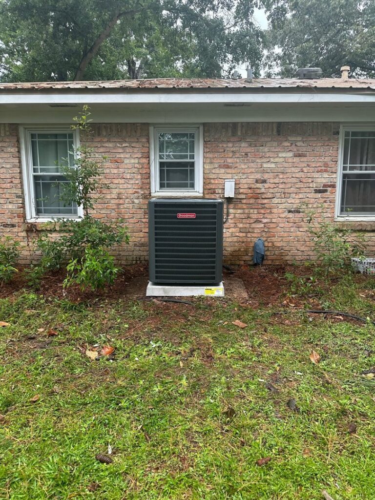 A Goodman air conditioning unit installed at a residential property by Zippers Heating and Cooling in Mobile, AL.