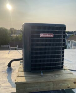 A Goodman AC unit installed on a rooftop by Tom's Heating & Air Conditioning LLC in Lacey Township, NJ.