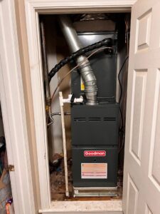 A Goodman furnace and air handler installed in a utility closet by B&B Hvac Llc in Memphis, TN.