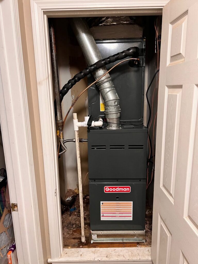 A Goodman furnace and air handler installed in a utility closet by B&B Hvac Llc in Memphis, TN.