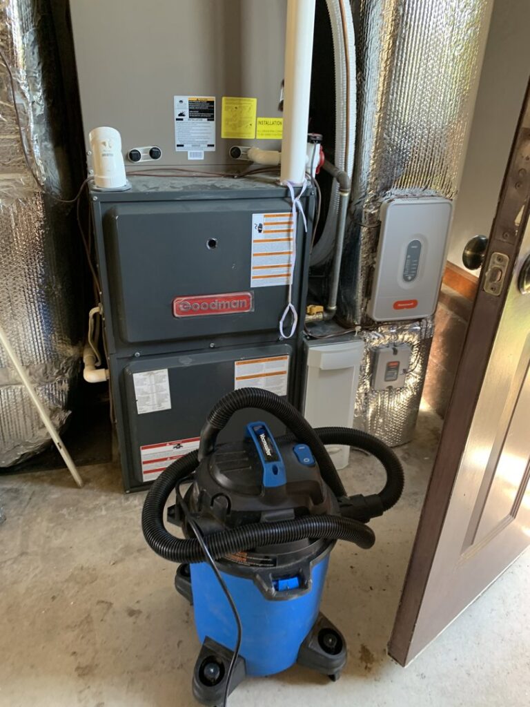 A Goodman furnace and air handler unit with ductwork, recently installed or serviced by Hendrix Heating & Air in Newport News, VA.