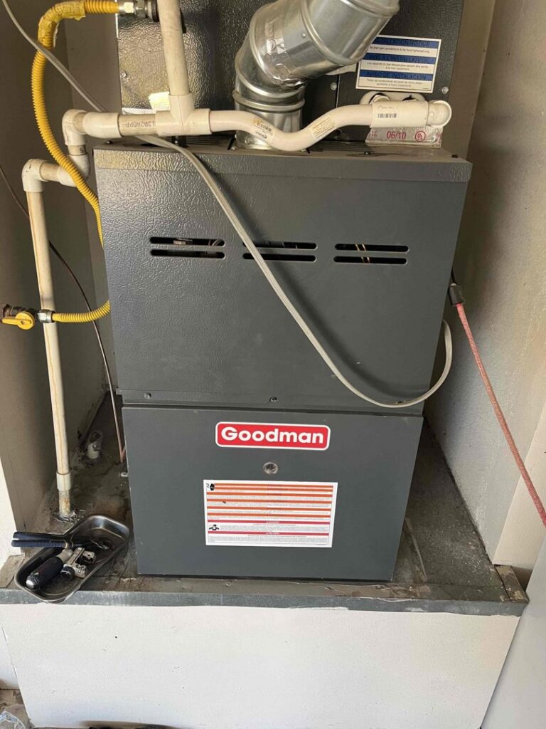 A Goodman furnace and air handler unit with ductwork and piping installed by One Hour Heating & Air Conditioning of West Valley in Phoenix, AZ