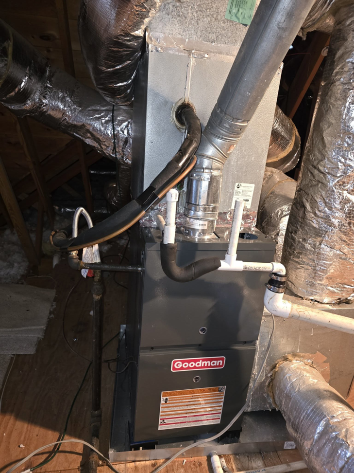 A Goodman furnace and air handler unit with ductwork installed in an attic by Smith Heat an Air, LLC in Southaven, MS.