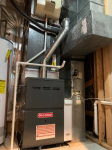 A newly installed Goodman furnace and air handler unit with ductwork by 495 HVAC in Annandale, VA.