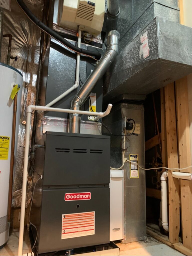A newly installed Goodman furnace and air handler unit with ductwork by 495 HVAC in Annandale, VA.