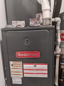 A Goodman brand furnace unit, indicating installation or service by AirTemp Heating & Cooling in Nashville, TN.