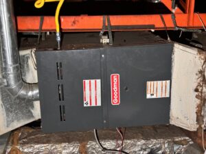A Goodman furnace and air handler unit installed in an attic by Metro Air Conditioning, Heating & Services in Dallas, TX