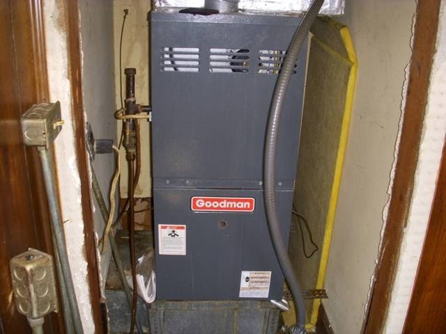 A Goodman furnace installed in a utility space by One Hour Heating & Air Conditioning of Springfield in Springfield, MO.