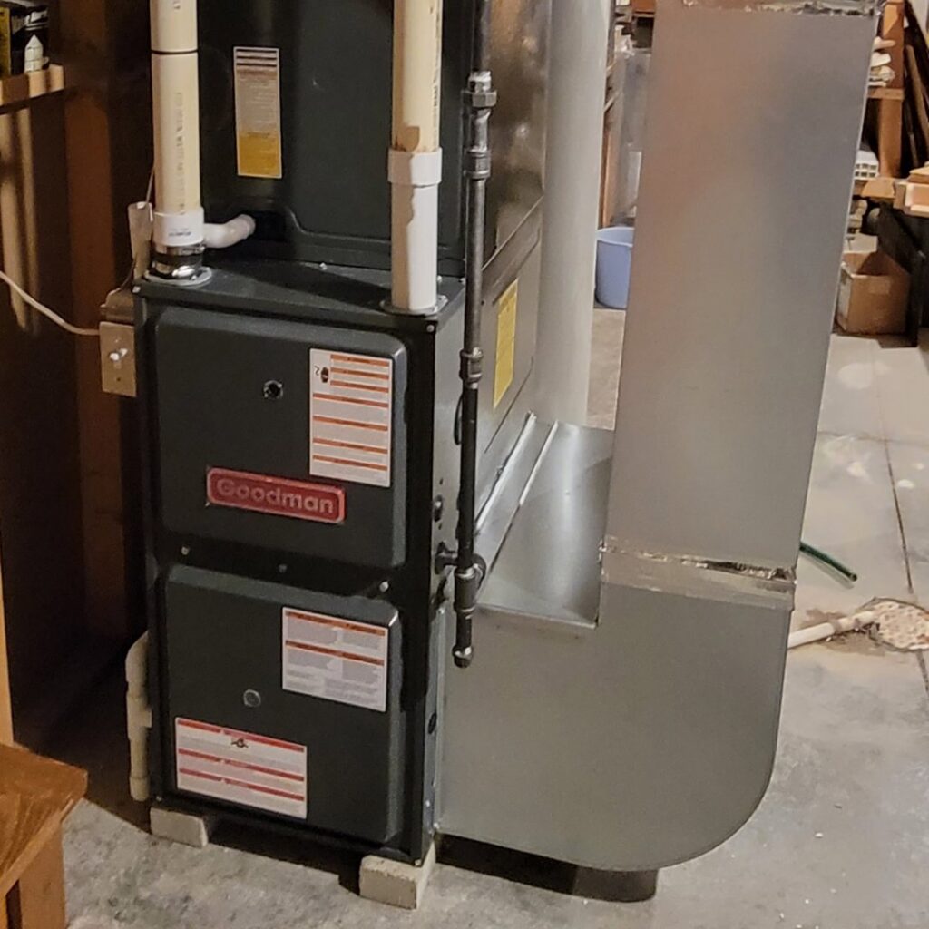 A newly installed Goodman furnace and air handler unit by Trade Allies Heating and Cooling in Ankeny, IA.