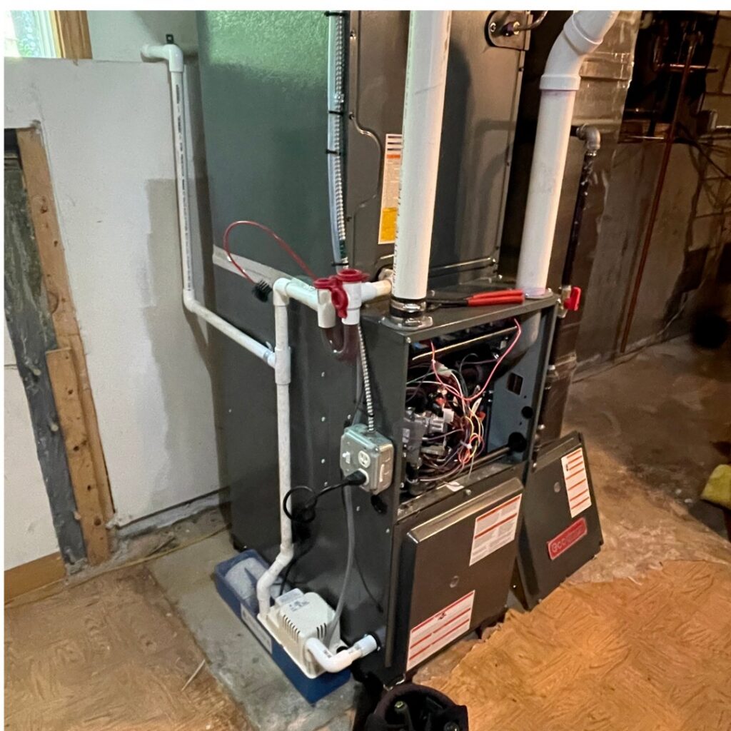 A Goodman furnace and air handler unit undergoing service or installation by Revolution HVAC in Owings Mills, MD.