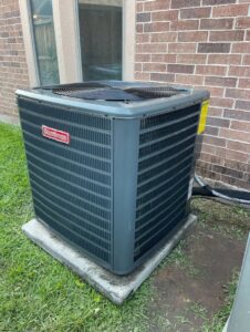 A Goodman HVAC condenser unit newly installed outside a residential home by ProTexAir HVAC Services in Houston, TX.