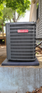 A newly installed Goodman HVAC condenser unit outside a residential property by Rocket Heating and Cooling LLC in Kansas City, MO.