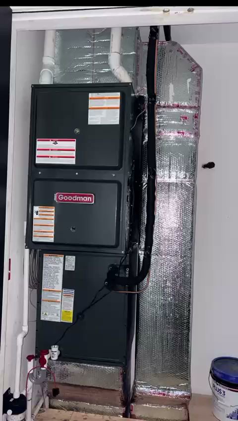 A Goodman HVAC system with ductwork installed in a utility closet by Fast Air in Zebulon, NC.