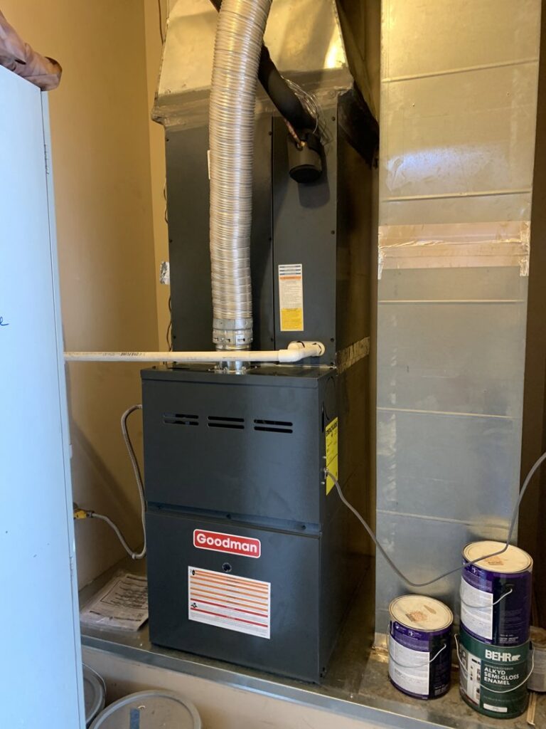 A Goodman indoor furnace and air handler unit with ductwork, installed by Valle Del Sol Home Services, LLC in Scottsdale, AZ.