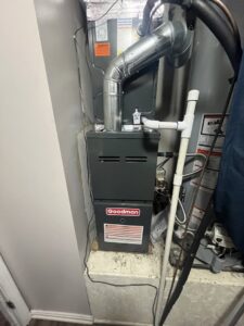 A Goodman indoor furnace and air handler unit with ductwork, installed by C&L Heating and Air in Louisville, KY.