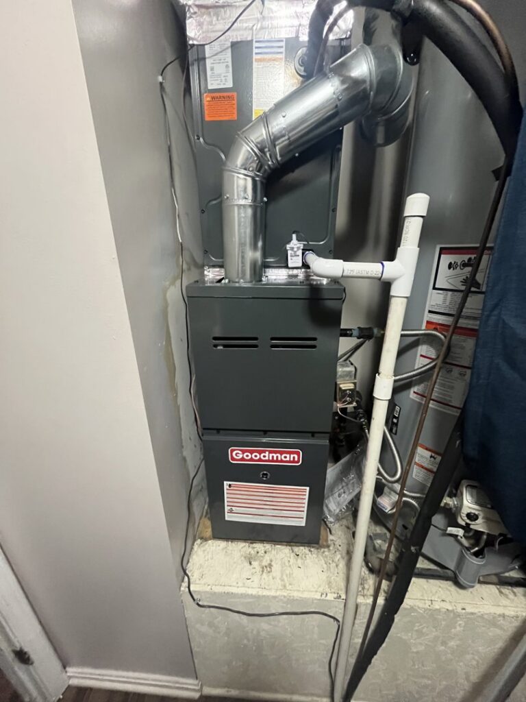 A Goodman indoor furnace and air handler unit with ductwork, installed by C&L Heating and Air in Louisville, KY.