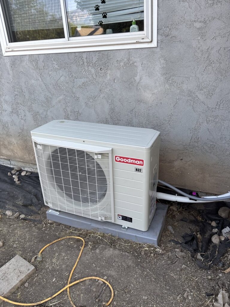 An outdoor Goodman mini-split condenser unit professionally installed by LUCAS Heating And Air LLC in Salt Lake City, UT.