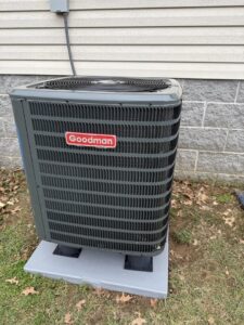 A newly installed Goodman outdoor air conditioning unit by C&L Heating and Air in Louisville, KY.
