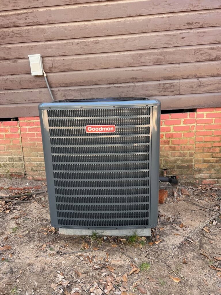 A Goodman outdoor air conditioning unit professionally installed by Johnson's A/C & Heating in Alexandria, LA.