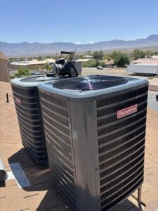 Two Goodman outdoor AC units installed on a rooftop by Buddy's Refrigeration LLC in Mesquite, NV.