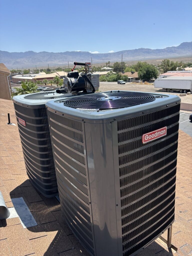 Two Goodman outdoor AC units installed on a rooftop by Buddy's Refrigeration LLC in Mesquite, NV.