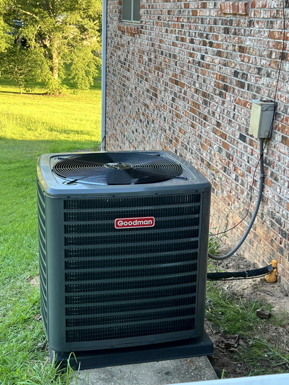 A Goodman outdoor HVAC condenser unit installed by Affordable heating and air conditioning in Meridian, MS.