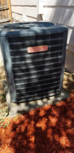 A Goodman brand outdoor HVAC unit installed by Western Sheet Metal Works Inc. for a home in Aurora, CO.