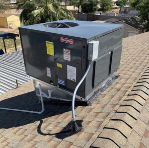 A new Goodman rooftop package HVAC unit installed on a residential roof by Valle Del Sol Home Services, LLC in Scottsdale, AZ.