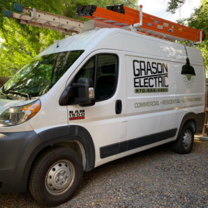 A Grason Electric service van with ladders on the roof rack, ready for electrical jobs in Fort Collins, CO.