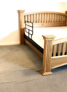 Close-up of a newly installed gray carpet in a bedroom by The Flooring Outfit, a carpet contractor in Mesa, AZ.