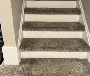 A plush gray textured carpet installed on a staircase by Garrard's Flooring Service LLC, a carpet contractor in Cleveland, OH.