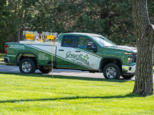 A Great Lawns Turf Care branded pickup truck with lawn care equipment in the bed, parked in Nashville, TN.
