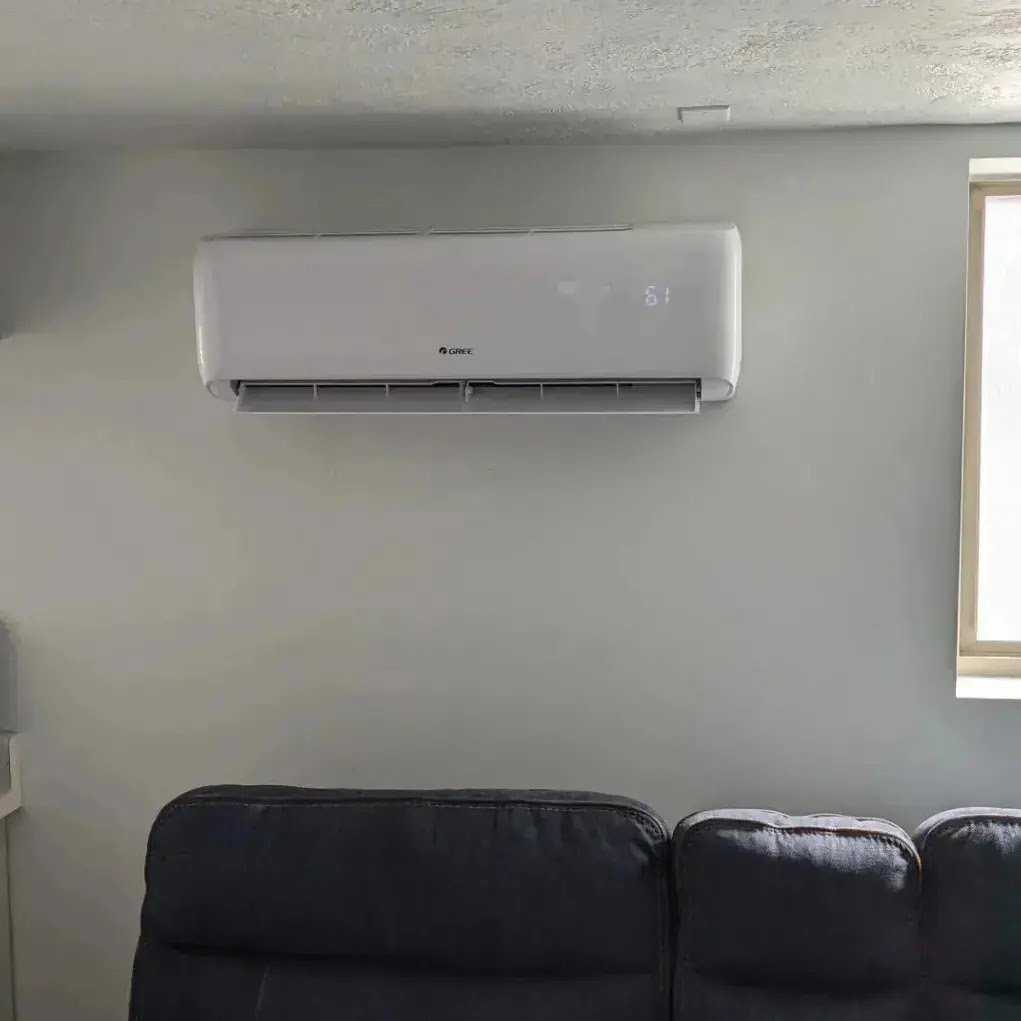 A Gree mini-split indoor unit installed in a living room by Inspector Rogers LLC in Draper, UT.