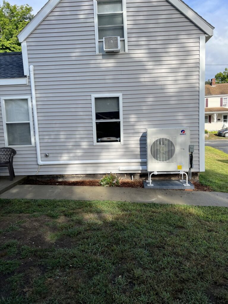 An outdoor Gree mini-split condenser unit installed by Quality Comfort Inc. in Aston, PA