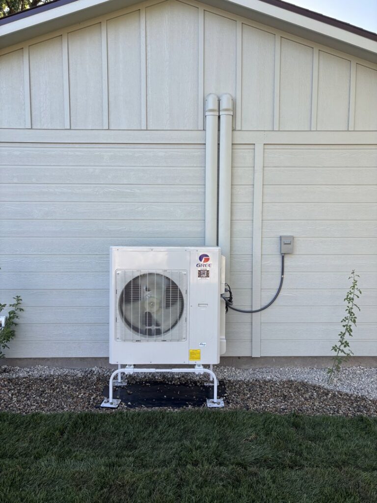 A Gree outdoor heat pump unit installed by Kingdom Heating and Air in Sacramento, CA.