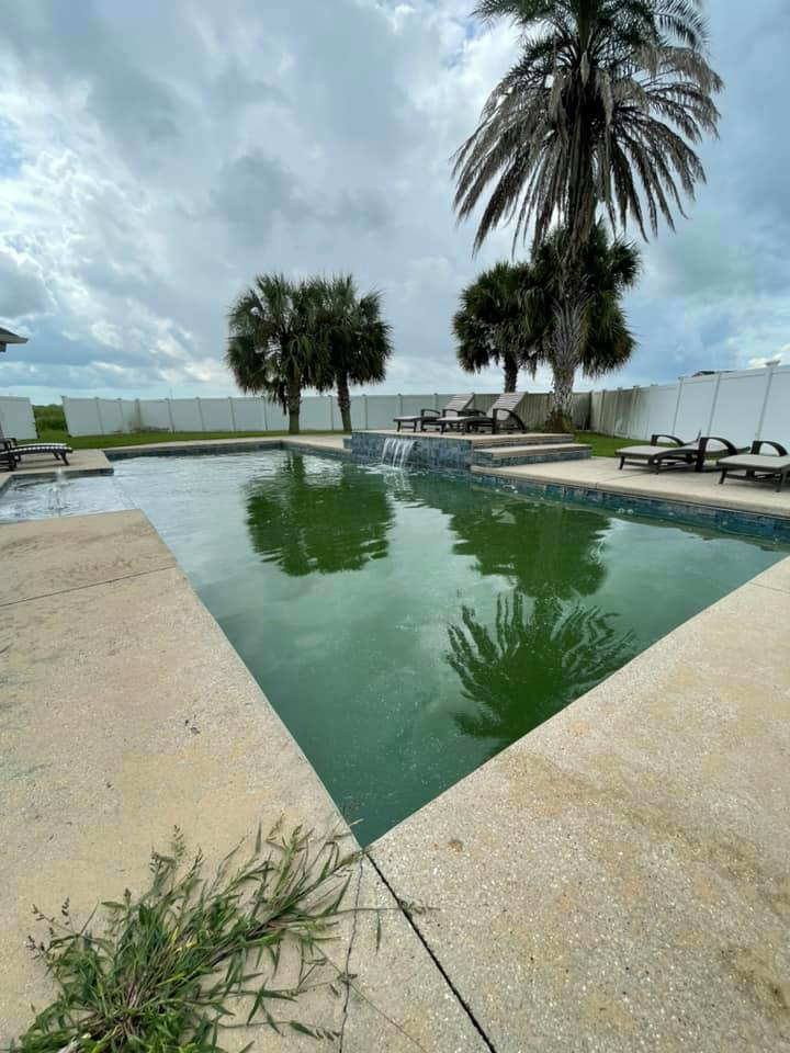 A green, algae-filled swimming pool before professional cleaning by Brocks Pools LLC in Baton Rouge, LA.