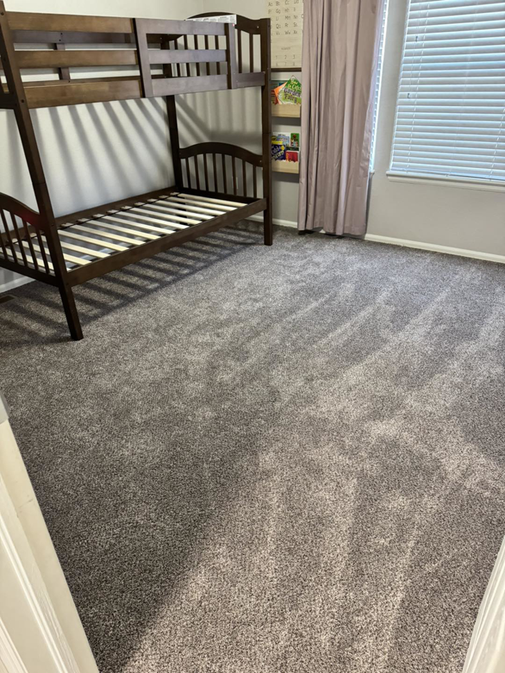 New grey carpet installed in a child's room, a service from Cruz Carpet / Vidal Cruz in Colorado Springs, CO