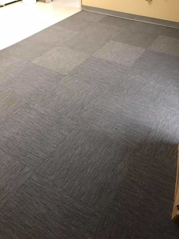 Newly installed grey carpet tiles in a commercial space by Jrc floor covering LLC in Lexington, SC.
