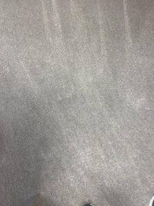 A grey carpet showing clear cleaning stripes after professional service by USA Clean Master in Baltimore, MD