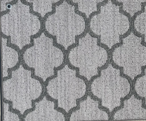 A close-up view of a grey patterned carpet sample offered by Erin Wruck Consulting LLC in Converse, TX