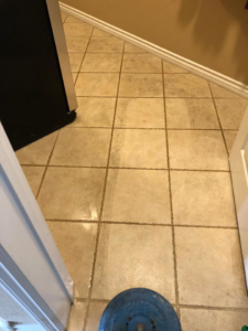 Grout cleaning in progress, showing a clean line on tile at Unlimited Carpet & Grout Cleaning in Las Vegas, NV.