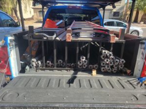 Gryffin Garage Door service truck loaded with ladders, tools, and garage door parts, ready for jobs in Chandler, AZ