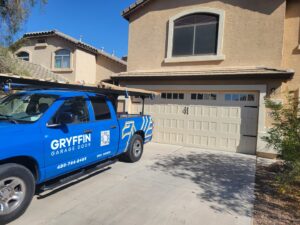 Gryffin Garage Door service truck parked in front of a residential garage, indicating on-site service in Chandler, AZ